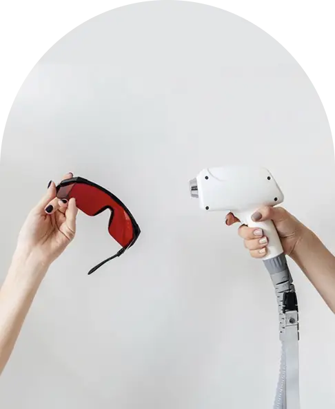 Laser treatment handpiece and protective eyewear